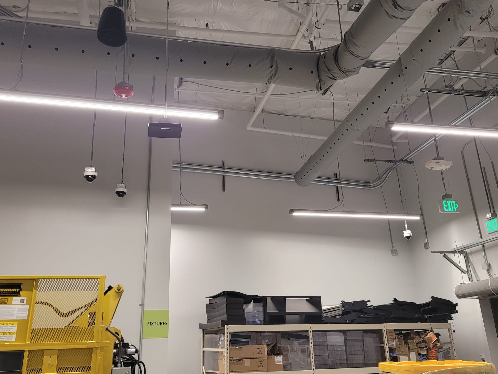Working facility with lighting, power and life-safety overhead