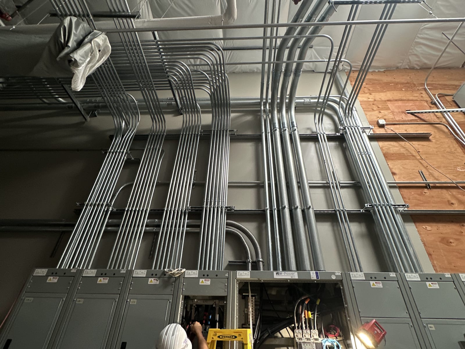 Feeder conduit racked into the service equipment